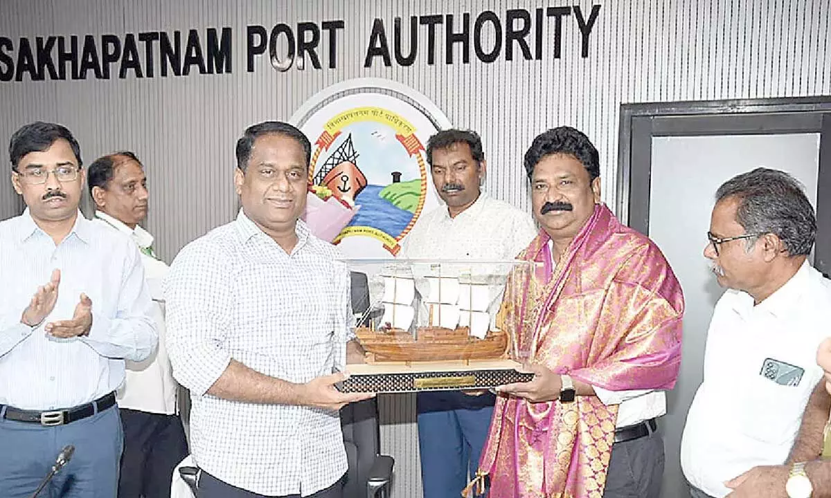 VPA chairperson M Angamuthu felicitating traffic manager B Ratna Sekhara Rao at a ceremony held at the port in Visakhapatnam