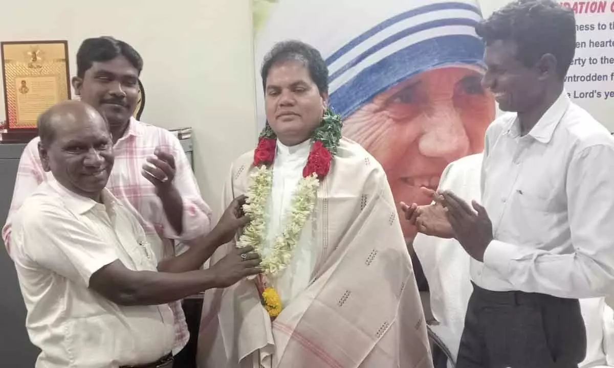 Father Rev. Balaraju honoured by Shanti Seva Society founder Madagalam Prasad