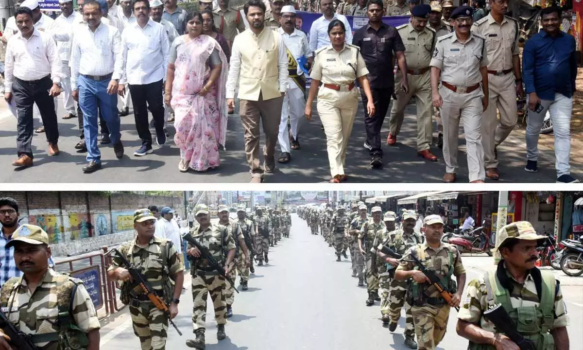 Collector V Prasanna Venkatesh, SP Mary Prasanthi, Joint Collector B Lavanyaveni and others taking part in flag march of police and armed forces in Eluru on Tuesday