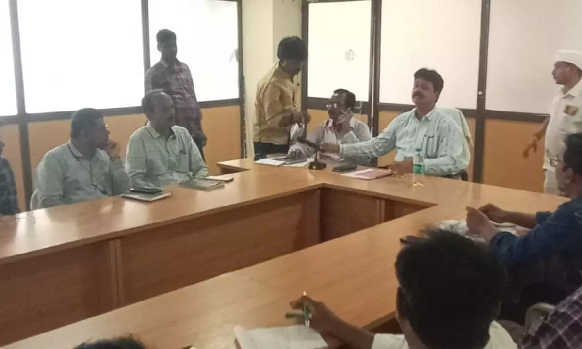DRDA PD and postal ballot nodal officer Anand Naik holding a meeting with officials at the DRDA meeting hall in Kadapa on Tuesday
