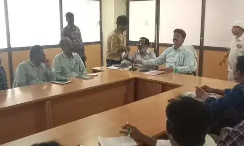 DRDA PD and postal ballot nodal officer Anand Naik holding a meeting with officials at the DRDA meeting hall in Kadapa on Tuesday