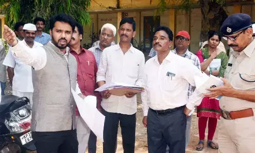 Collector V Prasanna Venkatesh instructing officials over preparations for the polling  material distribution centre in Eluru on Thursday
