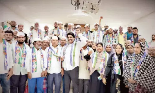 Sitting  YSRCP MLA Biyyapu Madhusudan Reddy with Muslims in Srikalahasti