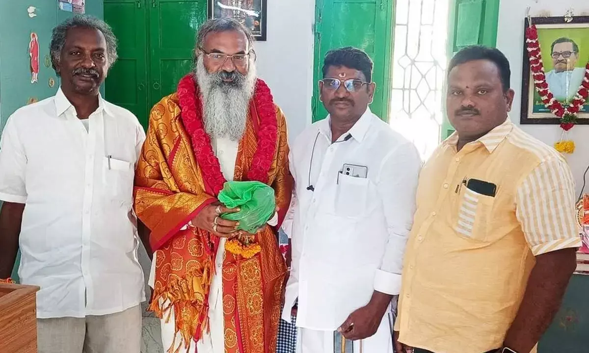 Arya Vysya community members felicitating Rachapudi Sai krishna on the auspicious occasion of ugadi in Badvel on Tuesday
