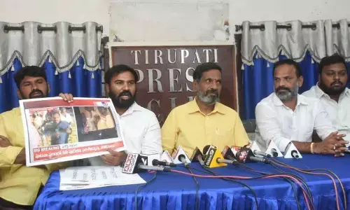 Telugu Yuvatha State general secretary A Ravi Naidu speaking to the media in Tirupati on Sunday. TDP Tirupati parliamentary president G Narasimha Yadav is also seen.
