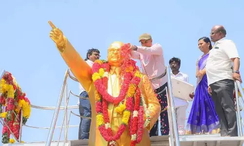 District Collector V Vijay Ramaraju, Joint Collector Ganesh Kumar, DRO Gangadhar, Social Welfare department DD Saraswati and others garlanding Dr Ambedkar’s statue in Kadapa on Sunday
