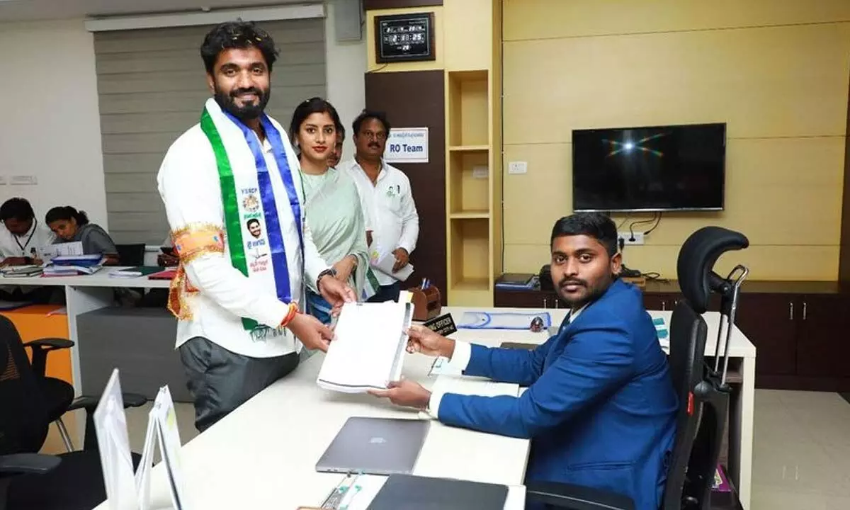 Margani Bharat submitting his nomination papers to Municipal Commissioner and Returning Officer K Dinesh Kumar
