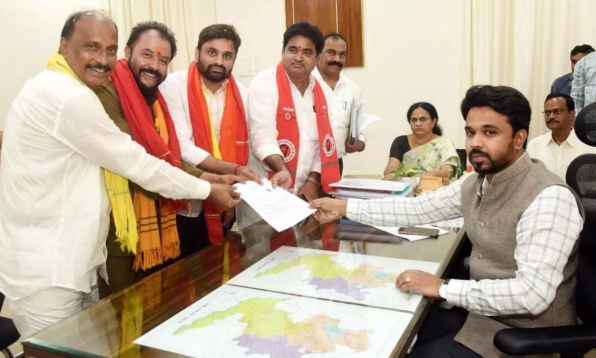 TDP candidate for Eluru Lok Sabha constituency Putta Mahesh Kumar submitting nomination to District Collector Prasanna Venkatesh in Eluru on Monday