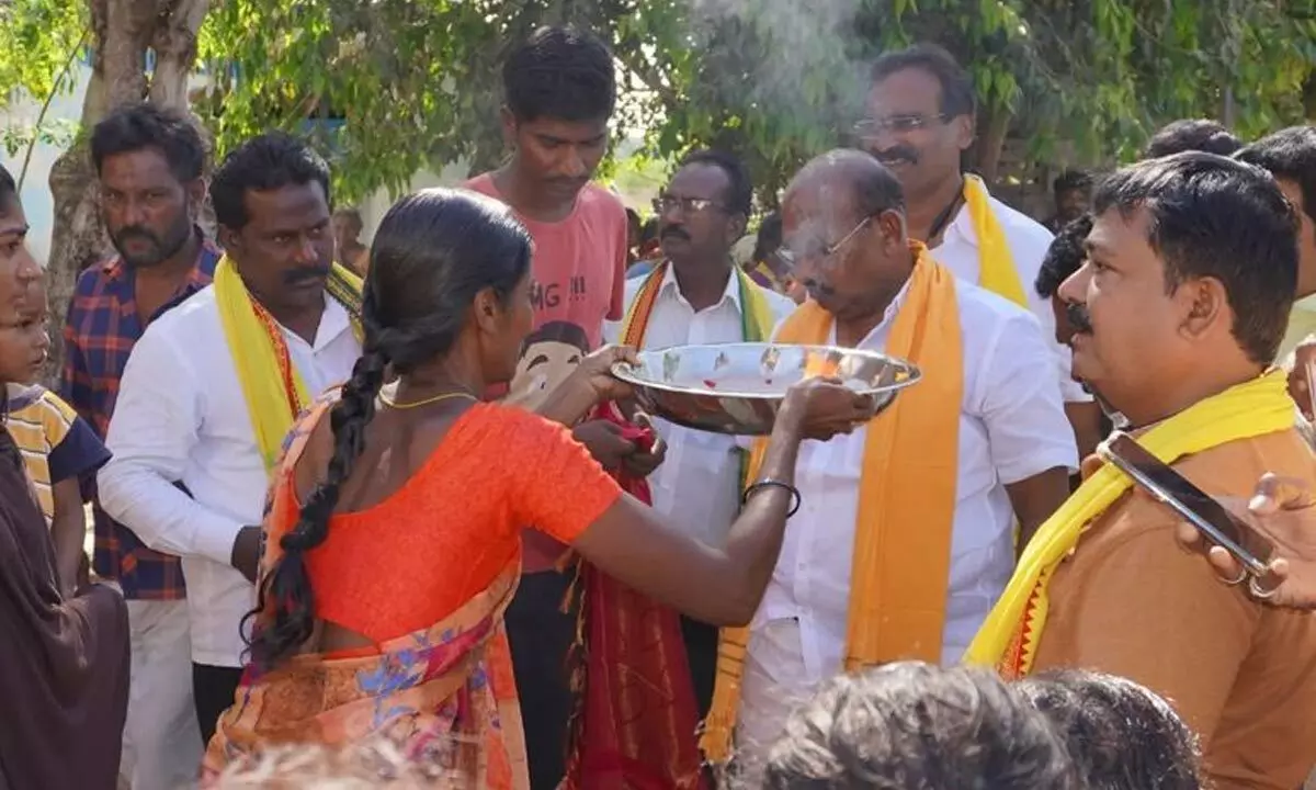 A woman welcomes Kurugondla Ramakrishna with harati during his visit in the constituency (file picture)
