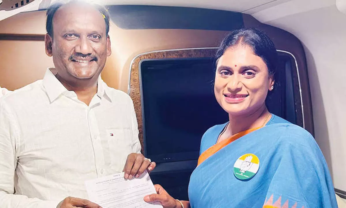 INC Chirala MLA candidate Amanchi Krishnamohan receiving B-Form from APCC president YS Sharmila Reddy in Chirala on Tuesday