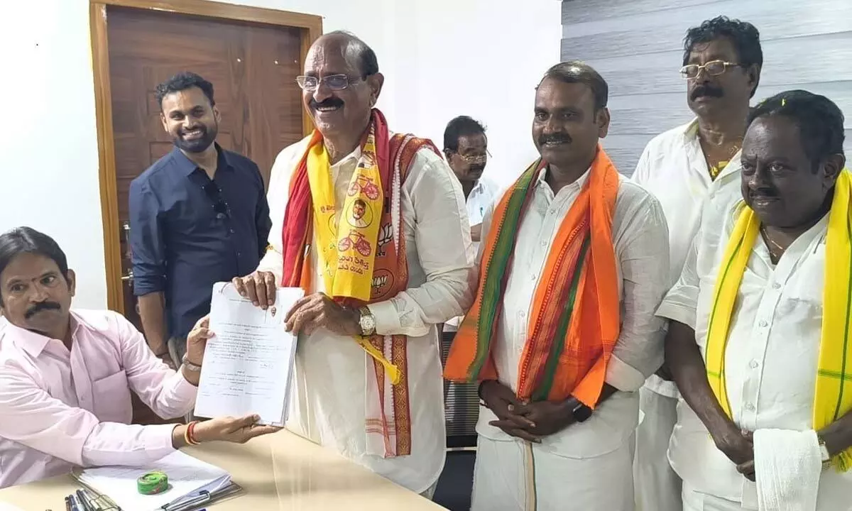 BJP candidate Kamineni Srinivas submitting nomination to returning officer in Kaikaluru