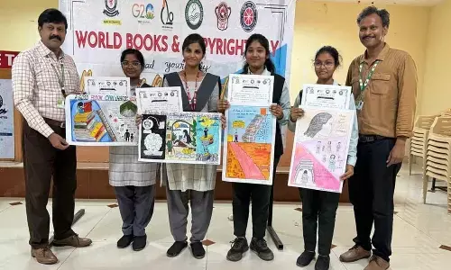 GIET School of Pharmacy Principal Dhana Raju and Librarian Shaik Meera with the winners of competition in Rajamahendravaram on Tuesday
