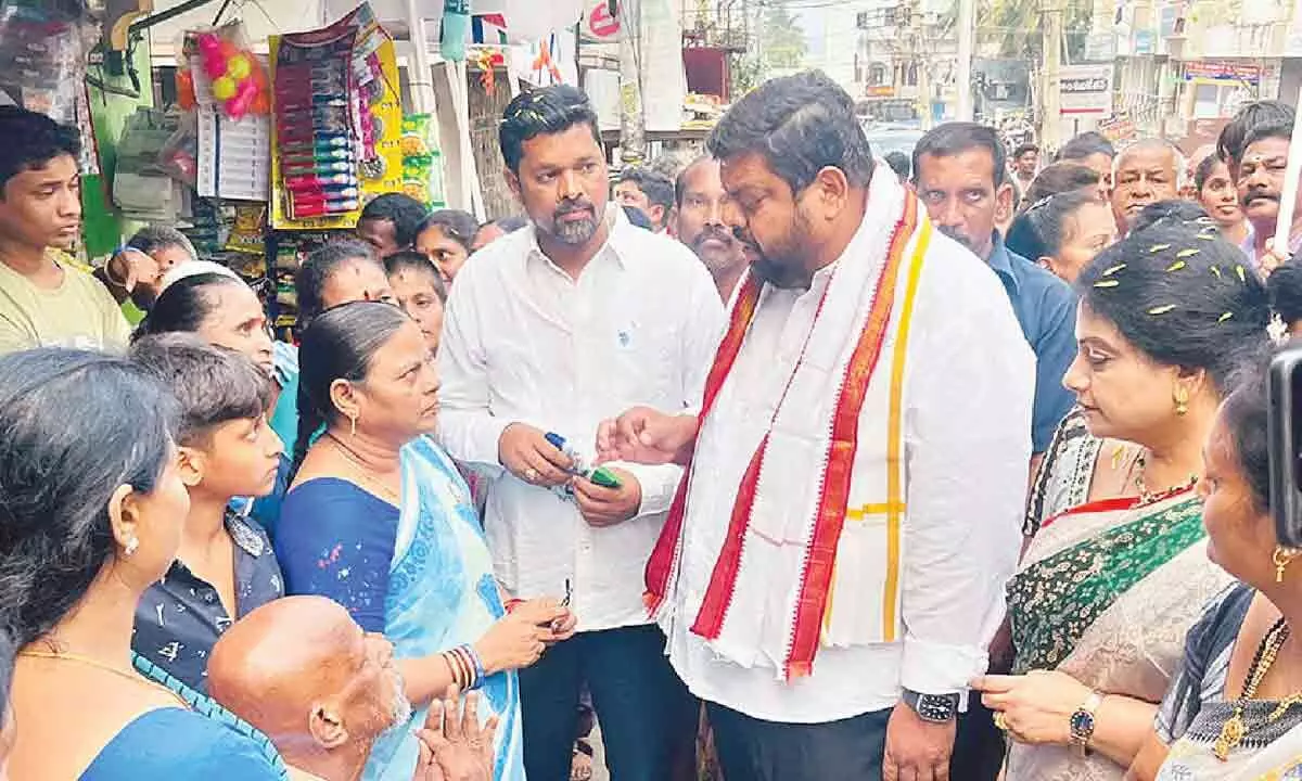 Visakhapatnam: YSRCP candidate Adari Anand Kumar conducts door-to-door campaign