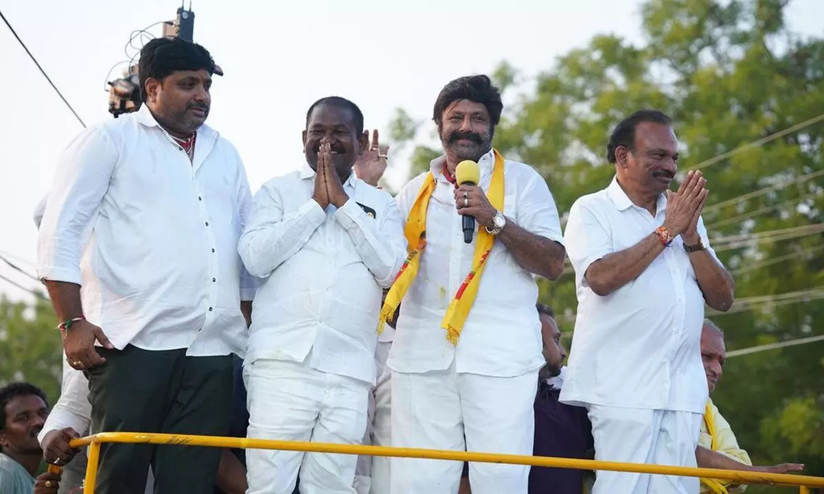TDP MLA Nandamuri Balakrishna takes part in electioneering at Marripudi in Prakasam district on Tuesday.  Party candidates D S B V Swamy and Magunta Srinivasulu Reddy are also seen.