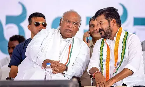 Congress President Mallikarjun Kharge and Telangana CM Revanth Reddy during a public meeting for Lok Sabha elections, at Gurmitkal in Yadgir district on Monday