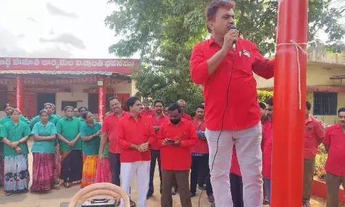 Janasena Party Celebrates International Labour Day with Market Yard Hamali Trade Union President in Eluru