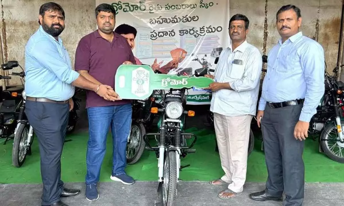Coromandel International Limited presenting mopeds to farmers in Guntur on Sunday