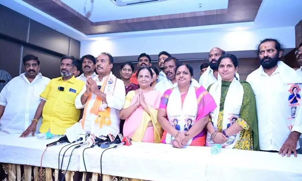 JSP candidate Jangalapalli Srinivasulu, TDP leaders M Sugunamma, G Narasimha Yadav and others with the two women corporators, who joined TDP, in Tirupati on Sunday