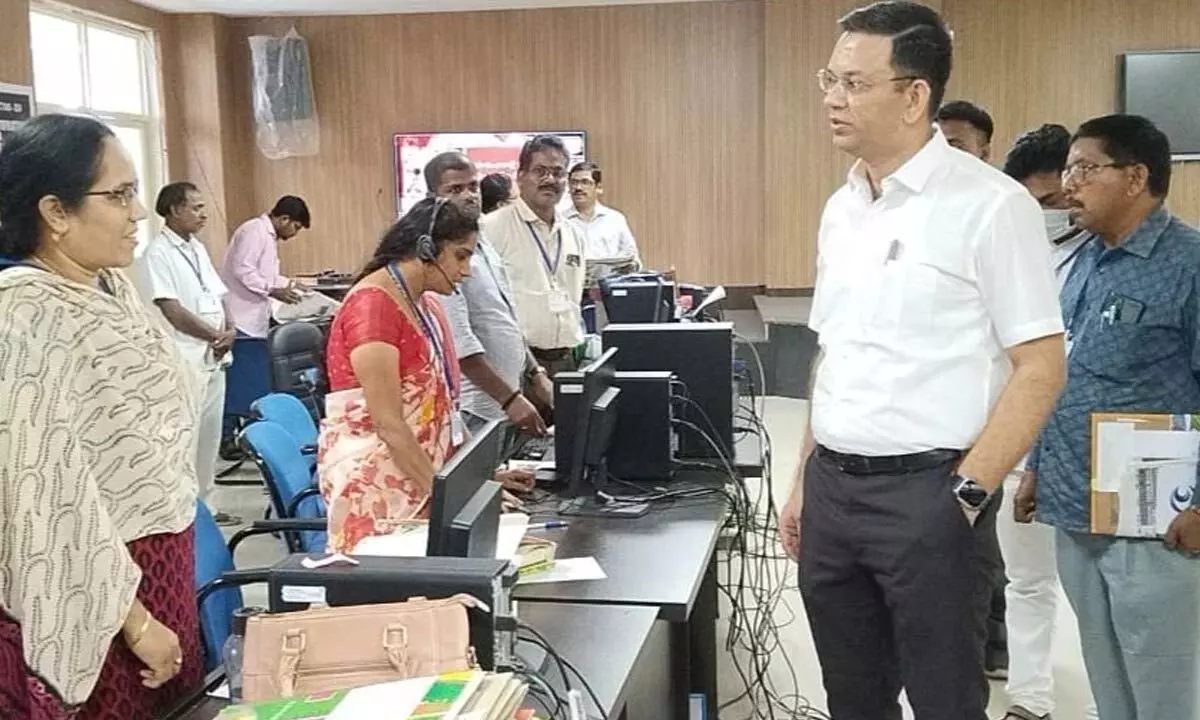 Election expenditure observer Naveen Kumar Sony interacting with control room staff at the collectorate in Srikakulam on Tuesday