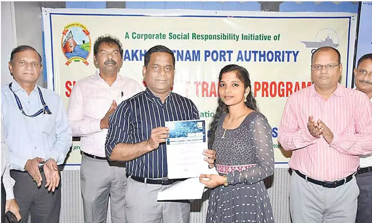 Chairperson of the Visakhapatnam Port Authority giving away a certificate to a student after the completion of a training programme in Visakhapatnam