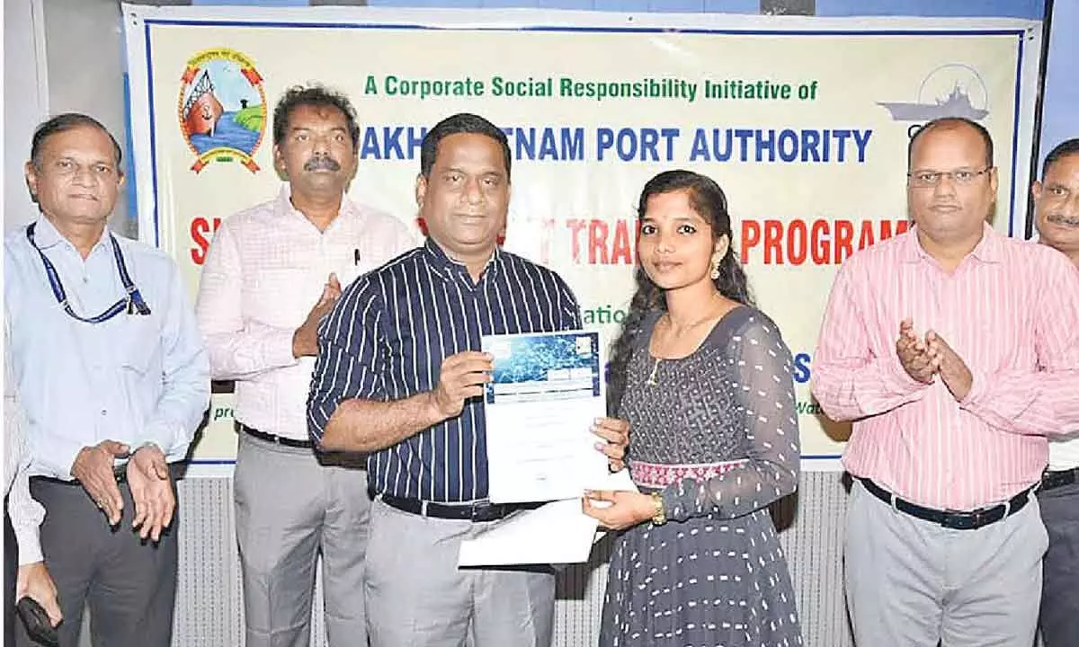 Chairperson of the Visakhapatnam Port Authority giving away certificates to students after the completion of their training in Visakhapatnam