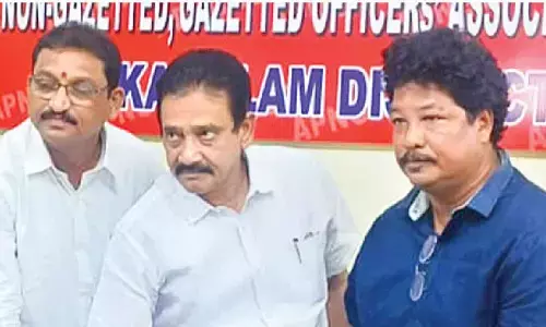 APNGOs association state general secretary Chowdari Purusottama Naidu (centre) releasing song on importance of vote in Srikakulam city on Thursday