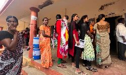 Nandyal: despite mild showers in the district women voters in large numbers are queued up to cast their votes from early in the morning.