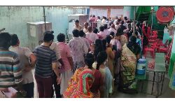 Voters waiting in queue line at polling booth no.66 in Gandhi road of Tirupati city. Voters waiting in queue line at polling booth no.66 in Gandhi road of Tirupati city.