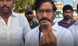 Sarvepalli constituency TDP nominee Somireddy Chandramohan Reddy exercise his franchise at Primary School in his native Allipuram of Nellore Rural mandal on Monday.