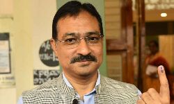 Chief Electoral Officer Mukesh Kumar Meena exercised his franchise at Railway function hall polling station in Vijayawada