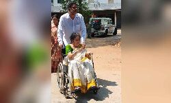 An elderly woman being assisted in a wheelchair at a polling booth in Seethammadhara in Visakhapatnam. An elderly woman being assisted in a wheelchair at a polling booth in Seethammadhara in Visakhapatnam.