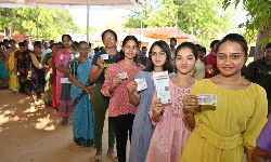 Young women who got voting right first time standing in the queue at Ramaiah School Polling center in Mulapet area in nellore city on Monday.