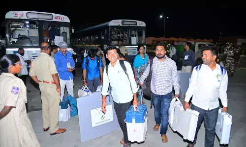 Election staff arriving at the reception centre