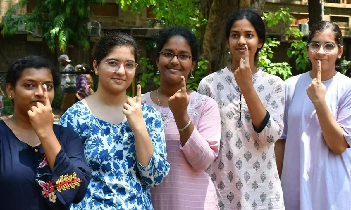 First time voters showing their index finger after casting their votes in Vijayawada on MondayPhoto:Ch Venkata Mastan