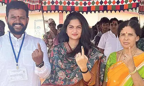 TDP-JSP-BJP alliance MP candidate K Rammohan Naidu casts his vote along with his wife and mother at Nimmada village in Tekkali constituency