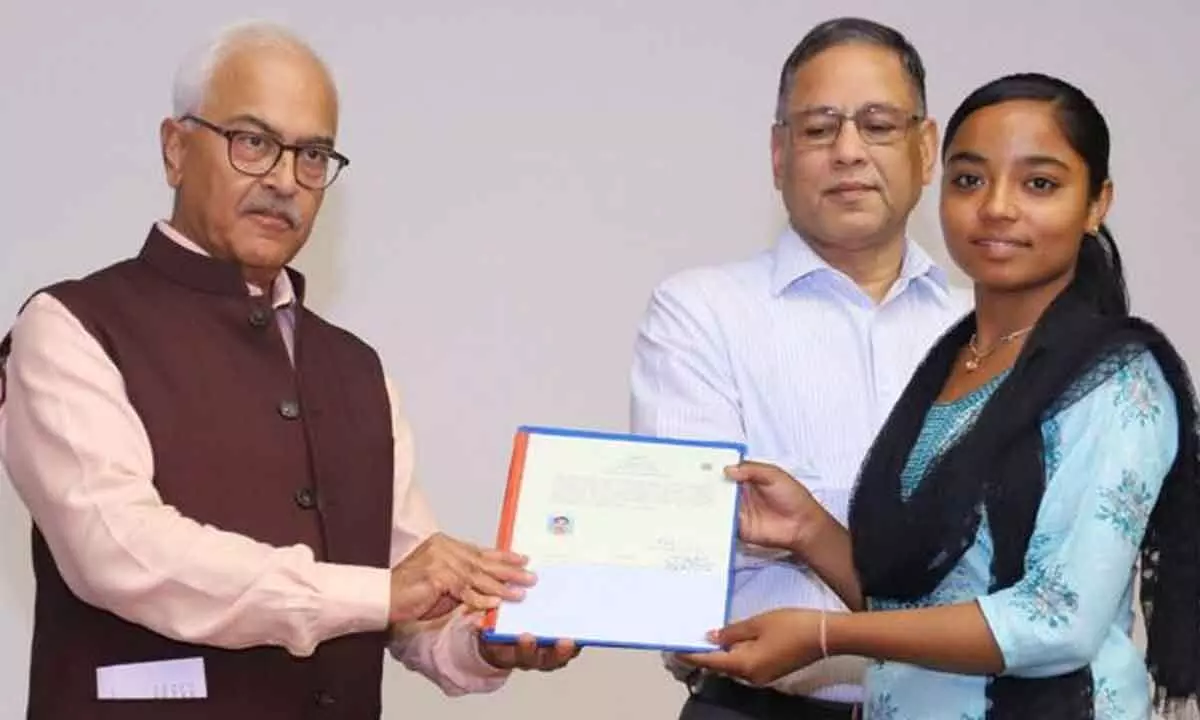 Union Home Secretary Ajay Kumar Bhalla hands over the first set of citizenship certificates under the Citizenship (Amendment) Act (CAA), in New Delhi on Wednesday