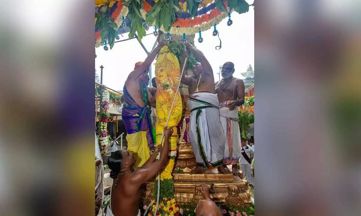 Priests performing Dwajarohanam at Sri Govindaraja Swamy temple in Tirupati on Thursday