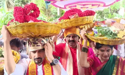 City MLA and TTD chairman Bhumana Karunakar Reddy carrying ‘sare’ to be presented to goddess Gangamma in Tirupati on Thursday. YSRCP MLA candidate Bhumana Abhinay Reddy is also seen.