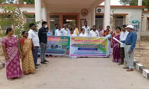 Medical staff and locals participating in a rally on National Dengue Day in Porumamilla on Thursday