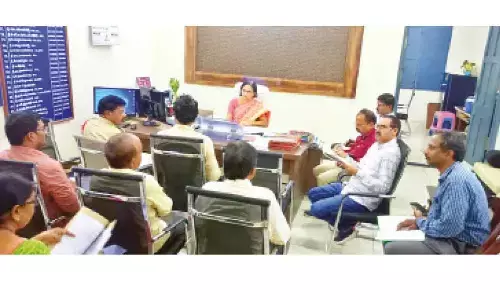 DRO D Pushpamani holding a review meeting with officials in Eluru on Thursday