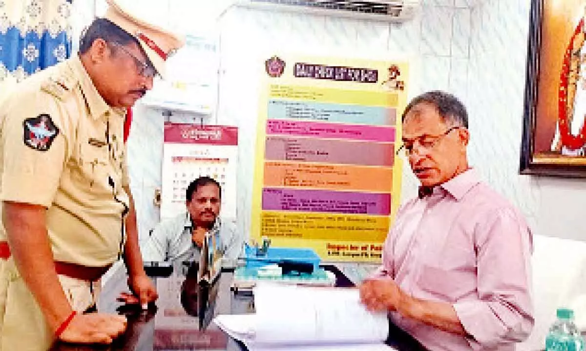 SIT members led by DSP Ravi Manohara Achari examining the records at SVU police station in Tirupati on Sunday