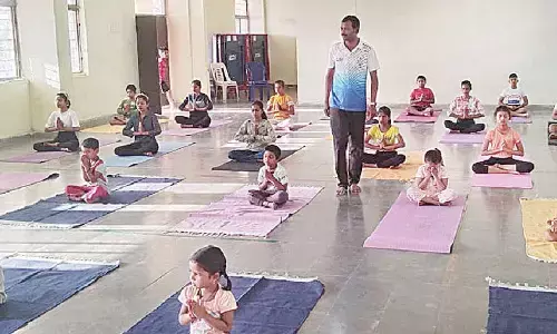 State Yoga Association general secretary Avinash Shetty conducting yoga training classes to  students in Joharapuram on Monday