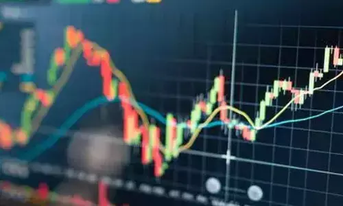 Sensex edges down, Nifty inches up in flat trading