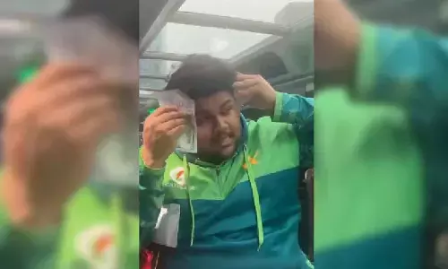 Pak cricketer courts row by wiping sweat with $