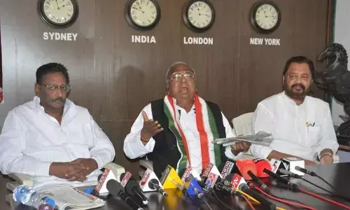 Senior Congress leader V Hanumantha Rao speaks to media in Rajamahendravaram on Thursday. Former MP G V Harsha Kumar (right) is also seen.