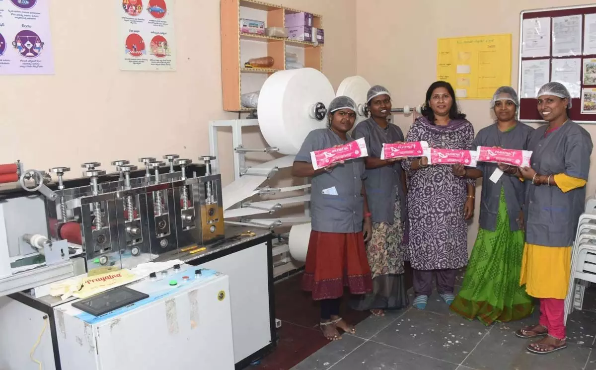 4 Women of a Self-Help Group supported by Amazon Manufacture 1200 Biodegradable Sanitary Napkins per hour at a Unit in Hyderabad