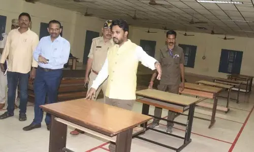 Collector V Prasanna Venkatesh giving instructions to staff during arrangements for counting in Eluru on Sunday