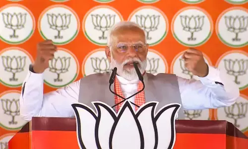 Prime Minister Narendra Modi addresses a public meeting for Lok Sabha elections, at Bansgaon in Gorakhpur district on Sunday