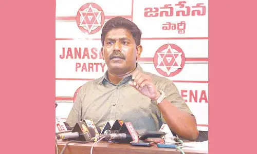 Jana Sena corporator Murthy Yadav addressing the media in Visakhapatnam on Sunday