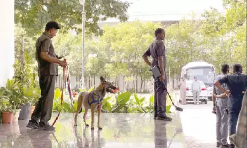 Bomb disposal team checks premises of Praja Bhavan, the official residence of Telangana Deputy Chief Minister Mallu Bhatti Vikramarka, after it received a bomb threat, in Hyderabad on Tuesday